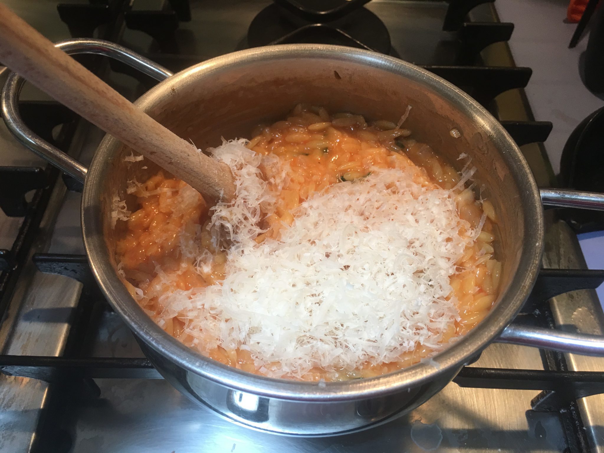 Risoni risottati - conditi col parmigiano